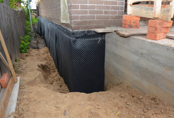 Happy homeowners after waterproofing job in New Tazewell